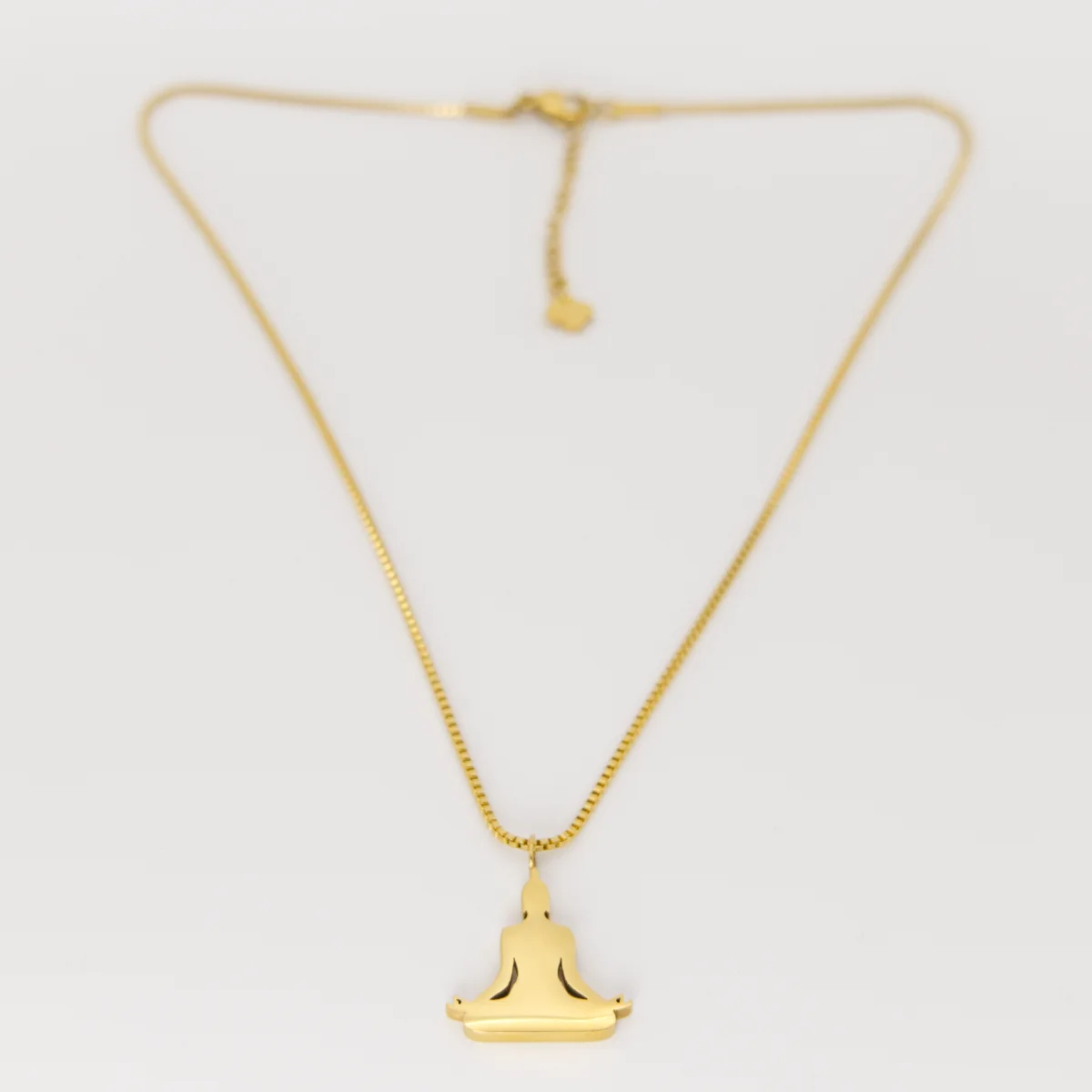 Buddha pendant laid flat