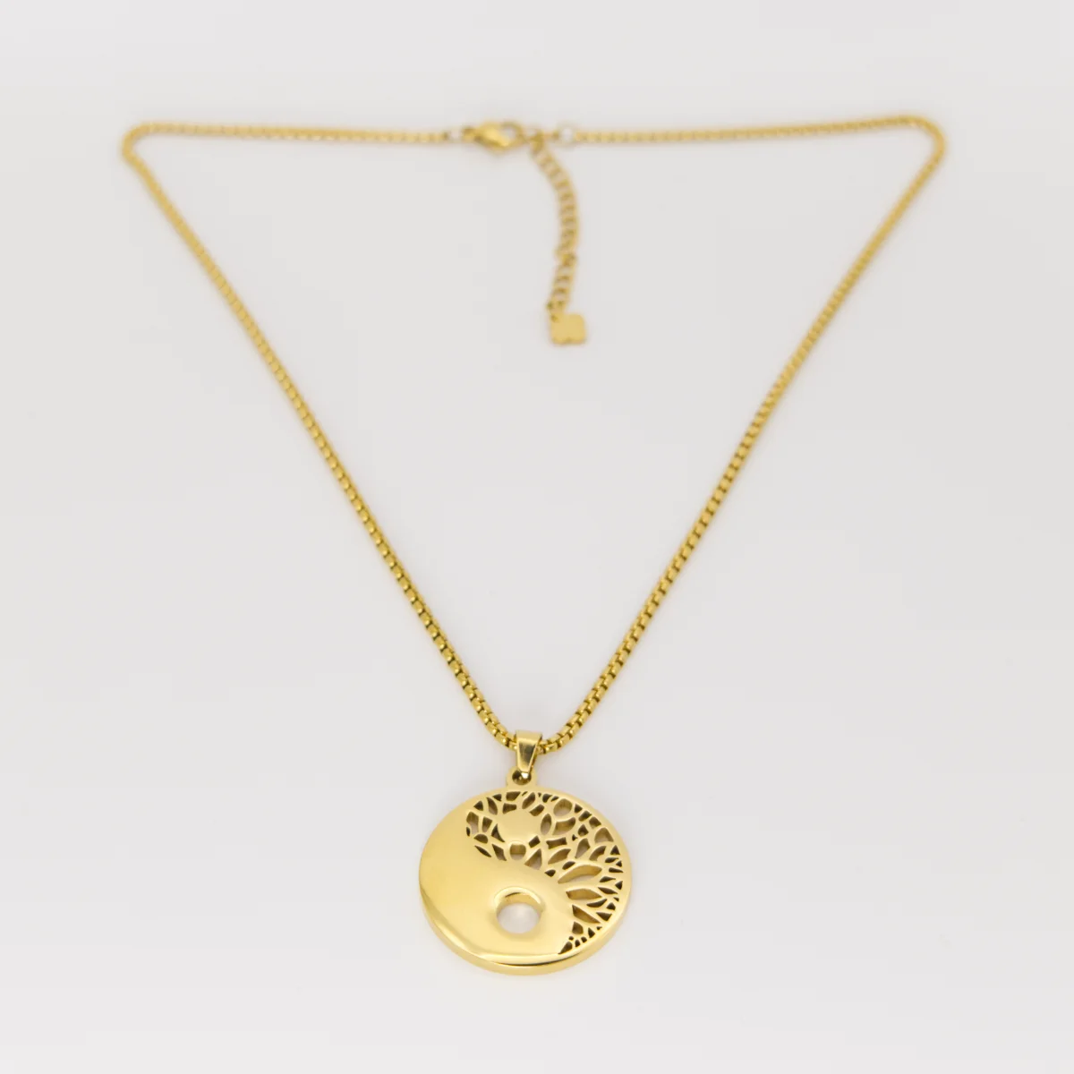 Yin & Yang necklace laid flat